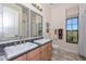 Bathroom boasts dual sinks, a shower, and a large window at 7275 N Scottsdale Rd # 1001, Paradise Valley, AZ 85253