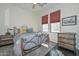 Cozy bedroom featuring a full-size bed and built-in shelving at 7275 N Scottsdale Rd # 1001, Paradise Valley, AZ 85253