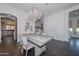 Bright dining room with a large wooden table and chandelier at 7275 N Scottsdale Rd # 1001, Paradise Valley, AZ 85253