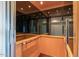 Interior of a modern home elevator with wood paneling and mirror at 7275 N Scottsdale Rd # 1001, Paradise Valley, AZ 85253