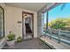 Covered entryway with bench and access to the interior of the home at 7275 N Scottsdale Rd # 1001, Paradise Valley, AZ 85253