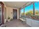 Covered entryway with bench and access to the interior of the home at 7275 N Scottsdale Rd # 1001, Paradise Valley, AZ 85253