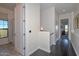 Bright hallway with dark wood floors and access to bathroom and bedroom at 7275 N Scottsdale Rd # 1001, Paradise Valley, AZ 85253