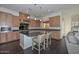 Modern kitchen with island seating and dark countertops at 7275 N Scottsdale Rd # 1001, Paradise Valley, AZ 85253