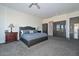 Main bedroom with plush carpet, large bed and ample closet space at 7275 N Scottsdale Rd # 1001, Paradise Valley, AZ 85253