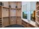 Large walk-in closet with ample shelving and window seat at 7275 N Scottsdale Rd # 1001, Paradise Valley, AZ 85253