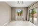 Bright dining room with tile flooring and sliding glass doors at 7846 W Adam Ave, Peoria, AZ 85382