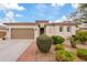 Beautiful single-story home with a two-car garage and well-manicured landscaping at 7846 W Adam Ave, Peoria, AZ 85382