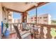 Private balcony with wicker furniture and city views at 7940 E Camelback Rd # 506, Scottsdale, AZ 85251