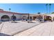 Community patio with tables, umbrellas, and BBQ grills at 7940 E Camelback Rd # 506, Scottsdale, AZ 85251