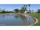 Landscaped pond with fountain, surrounded by grass at 7940 E Camelback Rd # 506, Scottsdale, AZ 85251