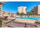 Relaxing community pool with ample lounge chairs and patio area at 7940 E Camelback Rd # 506, Scottsdale, AZ 85251