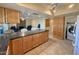 Kitchen with granite island and access to laundry at 8013 N Via Palma St, Scottsdale, AZ 85258