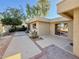 Sun-drenched patio with sliding glass doors leading to the house at 8013 N Via Palma St, Scottsdale, AZ 85258