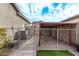 Backyard with gravel area, chain link fence, and AC unit at 815 S 151St Ln, Goodyear, AZ 85338