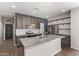 Modern kitchen with granite countertops and dark cabinets at 815 S 151St Ln, Goodyear, AZ 85338