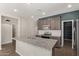 Modern kitchen with granite countertops and dark cabinets at 815 S 151St Ln, Goodyear, AZ 85338