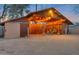 Rustic backyard studio with string lights and seating area at 8220 N 15Th Ave, Phoenix, AZ 85021