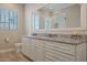 Bathroom with granite countertop and white cabinets at 8220 N 15Th Ave, Phoenix, AZ 85021