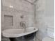 Bathroom with black clawfoot tub and marble tile at 8220 N 15Th Ave, Phoenix, AZ 85021