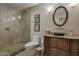 Elegant bathroom with a large walk-in shower and granite vanity at 8220 N 15Th Ave, Phoenix, AZ 85021