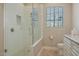 Bathroom with walk-in shower and pebble floor at 8220 N 15Th Ave, Phoenix, AZ 85021