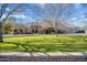 Elegant two-story home with a manicured lawn and circular driveway at 8220 N 15Th Ave, Phoenix, AZ 85021