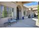 Inviting front porch with ornate bench and planters at 8220 N 15Th Ave, Phoenix, AZ 85021