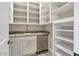 Walk-in pantry with ample shelving for storage at 8220 N 15Th Ave, Phoenix, AZ 85021