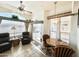 Bright dining area with wood table and chairs, adjacent to a cozy seating area at 840 S Aquamarine Dr, Apache Junction, AZ 85119