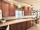 Bright kitchen with wood cabinets, white appliances, and a double sink at 840 S Aquamarine Dr, Apache Junction, AZ 85119