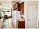 Corner kitchen detail featuring wood cabinets and a pantry at 840 S Aquamarine Dr, Apache Junction, AZ 85119