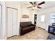 Living room with sofa, TV and access to laundry at 840 S Aquamarine Dr, Apache Junction, AZ 85119