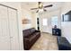 Living room with sofa, TV and access to laundry at 840 S Aquamarine Dr, Apache Junction, AZ 85119