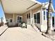 Covered patio with seating area and access to the mobile home at 840 S Aquamarine Dr, Apache Junction, AZ 85119