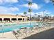 Inviting community pool with plenty of lounge chairs at 840 S Aquamarine Dr, Apache Junction, AZ 85119