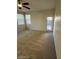 Bedroom with carpet flooring and sliding glass door to backyard at 8498 W Maya Dr, Peoria, AZ 85383