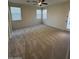 Bright bedroom with carpet flooring and access to backyard at 8498 W Maya Dr, Peoria, AZ 85383