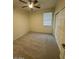 Well-lit bedroom with neutral walls and carpet flooring at 8498 W Maya Dr, Peoria, AZ 85383