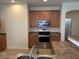 Kitchen features wood cabinets, stainless steel appliances, and plenty of counter space at 8498 W Maya Dr, Peoria, AZ 85383