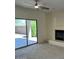 Carpeted living room with a sliding door and a fireplace at 8498 W Maya Dr, Peoria, AZ 85383