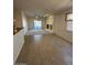 Open concept living room with tile flooring and a view to the kitchen at 8498 W Maya Dr, Peoria, AZ 85383