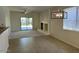 Living room with fireplace, sliding door, a ceiling fan, and modern light fixture at 8498 W Maya Dr, Peoria, AZ 85383