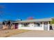 Ranch-style home with a brick facade and purple door at 936 E 8Th Pl, Mesa, AZ 85203