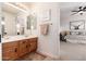 Double vanity bathroom with view to bedroom at 10756 E Ludlow Dr, Scottsdale, AZ 85255