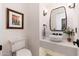 Modern bathroom with a stylish sink, sleek fixtures, and a frameless mirror at 10756 E Ludlow Dr, Scottsdale, AZ 85255