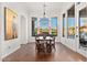 Formal dining room with hardwood floors, a large table, and a chandelier at 10756 E Ludlow Dr, Scottsdale, AZ 85255