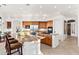 Modern kitchen with a large island, granite countertops, and wooden cabinetry at 10756 E Ludlow Dr, Scottsdale, AZ 85255