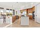 Open kitchen with large island, breakfast bar, and stainless steel appliances at 10756 E Ludlow Dr, Scottsdale, AZ 85255