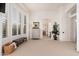 Bright bedroom with large windows, a dresser, and access to an ensuite bathroom at 10756 E Ludlow Dr, Scottsdale, AZ 85255